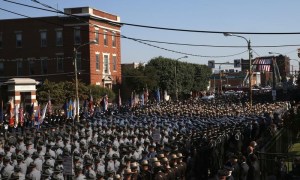 Pennsylvania State Police and Troopers from nearby states line streets outside St. Peters' Cathedral in Scranton, during funeral procession carrying slain Pennsylvania State Police Trooper Corporal Dickson to the Cathedral for his funeral service